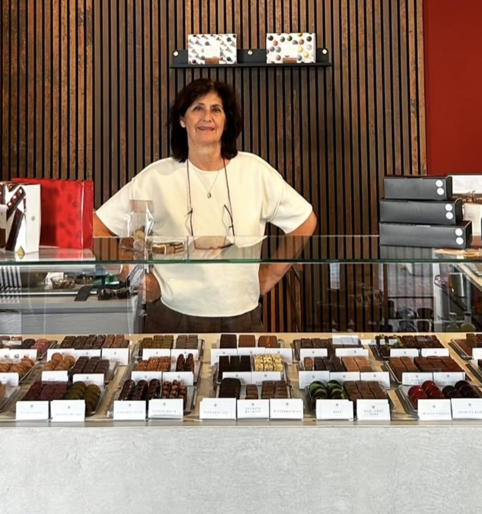 Christel behind the chocolate counter in her store in Amsterdam-Noord